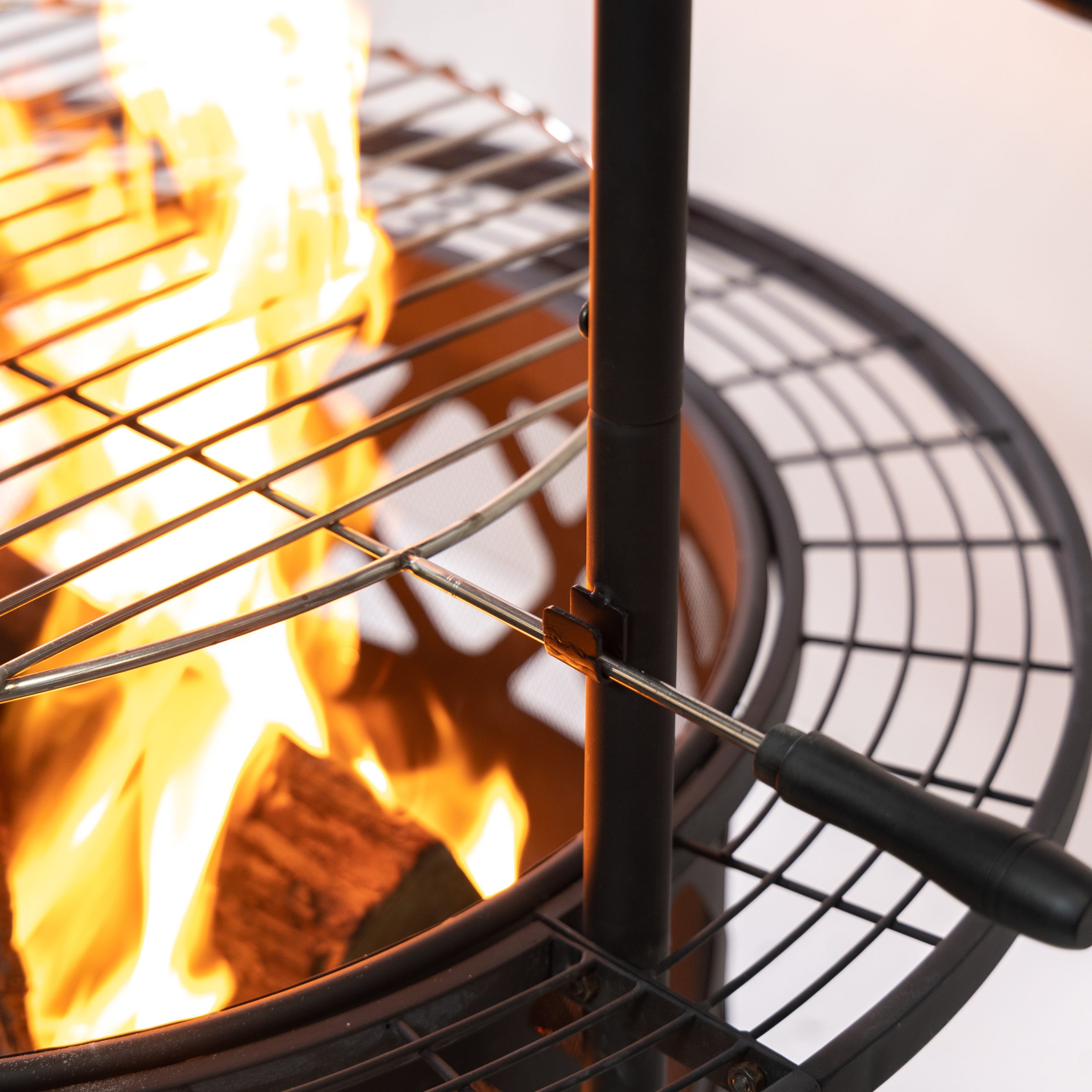 Deko Living 33 Inch Diameter Outdoor Steel Wood Burning Fire Pit with 2 Cooking Grills, Rotisserie and Poker - Image 9